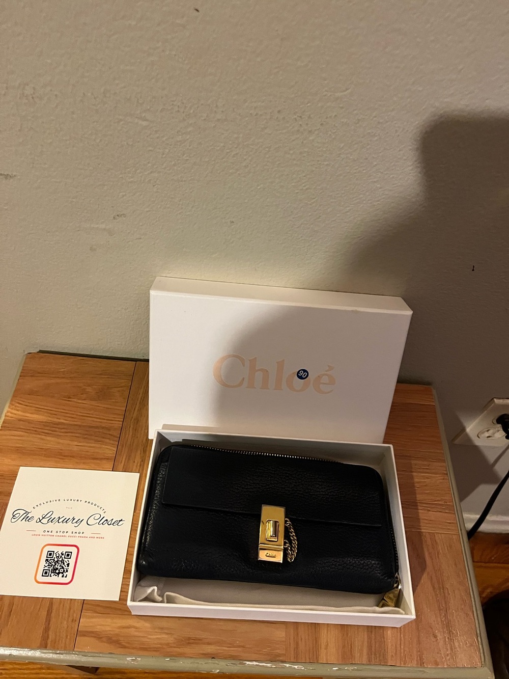 Navy blue Chloe Drew wallet on unbranded chain